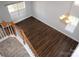 A view from the second story stairs looking down at the living room at 7830 Shiny Meadow Ln, Charlotte, NC 28215