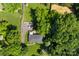 Bird's-eye view featuring a home with a manicured lawn, a long driveway, and a spacious fenced yard at 7921 Willhill Rd, Mint Hill, NC 28227