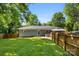 Fenced back yard with a patio area, gazebo, and tidy green grass near the home's exterior at 7921 Willhill Rd, Mint Hill, NC 28227