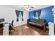 Bedroom featuring hardwood floors and a blue accent wall with constellations at 7921 Willhill Rd, Mint Hill, NC 28227