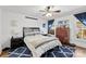 Inviting bedroom features a decorative rug, comfortable bed, and ample natural light at 7921 Willhill Rd, Mint Hill, NC 28227