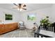 Bright bedroom featuring white walls, hardwood floors, and two windows at 7921 Willhill Rd, Mint Hill, NC 28227