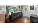 Cozy living room with hardwood floors and a decorative fireplace, showcasing a warm and inviting atmosphere at 7921 Willhill Rd, Mint Hill, NC 28227