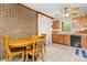 Kitchen nook featuring a ceiling fan, cozy brick wall and dining area at 8007 Red Lantern Rd, Indian Trail, NC 28079