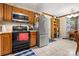 Well-equipped kitchen with stainless steel refrigerator and black appliances at 8007 Red Lantern Rd, Indian Trail, NC 28079