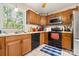 Functional kitchen featuring wooden cabinets and modern appliances at 8007 Red Lantern Rd, Indian Trail, NC 28079