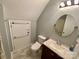Bathroom with granite sink, toilet and full sized door at 8742 Rittenhouse Cir, Charlotte, NC 28270