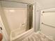 Bright bathroom featuring a shower and updated fixtures at 8742 Rittenhouse Cir, Charlotte, NC 28270