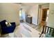 Bedroom featuring a crib, a blue chair, dresser and patterned floor rug at 8742 Rittenhouse Cir, Charlotte, NC 28270