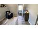 Cozy bedroom with natural light, and a blue chair by the window at 8742 Rittenhouse Cir, Charlotte, NC 28270