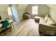 Bonus room featuring a sofa and a bean bag with natural light at 8742 Rittenhouse Cir, Charlotte, NC 28270