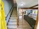 Inviting entryway with wood floors and a staircase leading to the upper level at 8742 Rittenhouse Cir, Charlotte, NC 28270