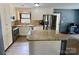 This remodeled kitchen has stainless steel appliances, granite countertops, and white cabinetry at 8742 Rittenhouse Cir, Charlotte, NC 28270