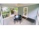 Screened-in porch with ceiling fan and seating area at 8742 Rittenhouse Cir, Charlotte, NC 28270