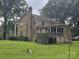 A rear exterior view of a multi-story home with a deck and screened porch at 9225 Robinson Church Rd, Charlotte, NC 28215