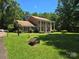 Beautiful home with big pillars and luscious green front lawn at 9225 Robinson Church Rd, Charlotte, NC 28215