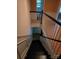 A home staircase with dark treads and white risers, leading to the lower level at 9225 Robinson Church Rd, Charlotte, NC 28215