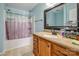 Clean bathroom with vanity, framed mirror and shower at 9623 Duxford Ln, Charlotte, NC 28269