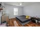 Bedroom with wood floors, overhead fan and natural light from window at 9623 Duxford Ln, Charlotte, NC 28269