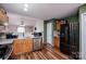 Functional kitchen featuring modern stainless steel appliances and hardwood floors at 9623 Duxford Ln, Charlotte, NC 28269