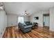 Spacious living room with vaulted ceiling, hardwood floors, ceiling fan and sliding glass doors at 9623 Duxford Ln, Charlotte, NC 28269