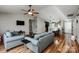 Open living space with hardwood floors flowing into dining area at 9623 Duxford Ln, Charlotte, NC 28269