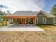 This home's rear exterior features a covered patio and outdoor seating, perfect for relaxing at 0000 Trull Hinson Rd # 2, Wingate, NC 28174