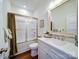 Bright bathroom featuring a large framed mirror, white cabinets and a shower with glass doors at 0000 Trull Hinson Rd # 2, Wingate, NC 28174
