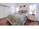 Cozy bedroom with a plush bed, decorative pillows, barn-style door, and natural light at 0000 Trull Hinson Rd # 2, Wingate, NC 28174