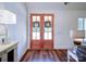 Warm entryway with double doors and hardwood floors create an inviting feel at 0000 Trull Hinson Rd # 2, Wingate, NC 28174