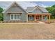 Charming home boasts attractive wood details, manicured landscaping, and a welcoming entrance at 0000 Trull Hinson Rd # 2, Wingate, NC 28174