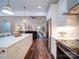 Open-concept kitchen with stainless steel appliances, island seating, and views into the living room at 0000 Trull Hinson Rd # 2, Wingate, NC 28174