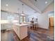 The kitchen offers a large island, modern lighting, white cabinets, and stainless appliances at 0000 Trull Hinson Rd # 2, Wingate, NC 28174