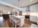 Open-concept kitchen featuring a kitchen island, pendant lighting, and seating at the island at 0000 Trull Hinson Rd # 2, Wingate, NC 28174
