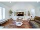 The living room features a entertainment center, high ceilings, and hardwood floors at 0000 Trull Hinson Rd # 2, Wingate, NC 28174