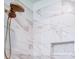 Close-up of a shower featuring marble tile walls, a rainfall shower head, and a built-in niche at 0000 Trull Hinson Rd # 2, Wingate, NC 28174
