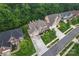 Stunning aerial view of a neighborhood showcasing well-manicured lawns, mature trees, and beautiful homes at 10620 Euclid Nw Ave, Concord, NC 28027
