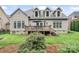 Home featuring a spacious deck, walkout basement, large backyard, and mature trees offering privacy at 10620 Euclid Nw Ave, Concord, NC 28027