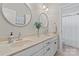 Elegant bathroom featuring double sinks, modern fixtures, and neutral wall colors at 10620 Euclid Nw Ave, Concord, NC 28027