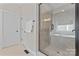 Bathroom features a glass shower and a soaking tub below a window at 10620 Euclid Nw Ave, Concord, NC 28027
