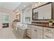 Bright primary bath offers dual vanities, a soaking tub, and a separate glass shower at 10620 Euclid Nw Ave, Concord, NC 28027