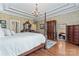 Bedroom features elegant decor, a canopy bed, and views into the attached bathroom at 10620 Euclid Nw Ave, Concord, NC 28027