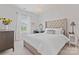 Bright, neutral bedroom with large windows and updated lighting at 10620 Euclid Nw Ave, Concord, NC 28027