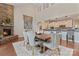 Spacious dining room with stone fireplace adjacent to kitchen and living area at 10620 Euclid Nw Ave, Concord, NC 28027