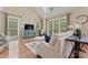 Comfortable living room with large windows and vaulted ceiling for natural light at 10620 Euclid Nw Ave, Concord, NC 28027