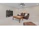 Comfortable living room with plush carpet, leather sofa, ceiling fan, and decorative coffee table at 10620 Euclid Nw Ave, Concord, NC 28027