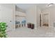 Mudroom with built-in bench seating, storage cabinets, and tile flooring at 10620 Euclid Nw Ave, Concord, NC 28027