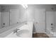 Bright bathroom featuring a double vanity, a large mirror and two separate shower/tub combos at 11109 Pond Valley Ct, Charlotte, NC 28269