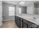 Bathroom features a large double vanity with a large mirror and tiled floors at 11109 Pond Valley Ct, Charlotte, NC 28269