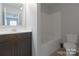 Bathroom features a single vanity with cabinet storage, toilet and shower/tub combo at 11109 Pond Valley Ct, Charlotte, NC 28269